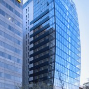 Exterior view of the Lucient apartments in Melbourne apartment, architecture, building, city, commercial building, condominium, corporate headquarters, daytime, downtown, facade, headquarters, hotel, landmark, metropolis, metropolitan area, mixed use, neighbourhood, real estate, reflection, residential area, sky, skyscraper, tower block, urban area, teal, blue