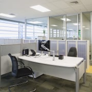 Office Max has recently moved to a new desk, floor, furniture, office, product design, gray