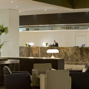 Interior view of the refurbished Sofitel Brisbane which countertop, interior design, kitchen, lobby, brown, orange