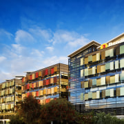 Exterior view of the Bendigo Bank sustainable building apartment, architecture, building, city, commercial building, condominium, corporate headquarters, daytime, facade, home, hotel, house, metropolis, metropolitan area, mixed use, neighbourhood, property, real estate, residential area, sky, suburb, tower block, urban area, blue