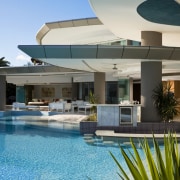 Exterior view of the outdoor area which features architecture, condominium, estate, home, hotel, house, leisure, leisure centre, property, real estate, resort, swimming pool, vacation, villa, water, teal