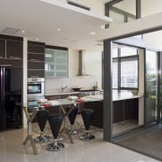 View of a custom-designed kitchen which features a house, interior design, real estate, window, gray, black