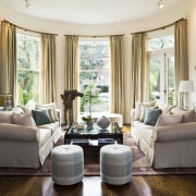 View of one of the lounge areas showing ceiling, couch, furniture, home, interior design, living room, real estate, room, window, window treatment, white