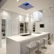 View of kitchen which features a kitchen island architecture, ceiling, countertop, daylighting, interior design, kitchen, product design, gray