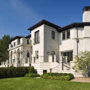 Exterior view of Renaissance styled home with stucco building, cottage, elevation, estate, facade, historic house, home, house, mansion, neighbourhood, official residence, property, real estate, residential area, villa, window