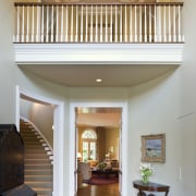 View of the entrance foyer with stairway and architecture, ceiling, daylighting, estate, floor, flooring, handrail, hardwood, home, house, interior design, living room, lobby, molding, real estate, room, stairs, wall, window, wood, wood flooring, brown, white