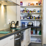 View of kitchen designed by Sheryl Stuart of cabinetry, countertop, home appliance, interior design, kitchen, major appliance, refrigerator, room, white