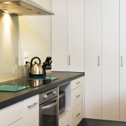 View of kitchen designed by Sheryl Stuart of cabinetry, countertop, cuisine classique, home appliance, interior design, kitchen, major appliance, room, white