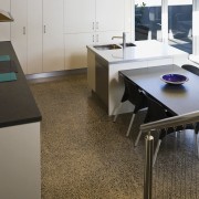 View of kitchen designed by Sheryl Stuart of countertop, floor, flooring, furniture, interior design, kitchen, product design, table, gray