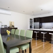 Image of the dining area in this home dining room, house, interior design, kitchen, property, real estate, room, table, white