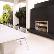 Image of easy to use, outdoor fireplace designed fireplace, floor, flooring, furniture, hearth, home appliance, interior design, living room, product design, property, white, black