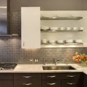 View of the textured stainless steel backsplash, cabinetry, bathroom, cabinetry, countertop, flooring, interior design, kitchen, sink, tile, under cabinet lighting, brown, orange