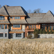 Exterior view of this home designed by Charlie building, cottage, estate, facade, farmhouse, home, house, mansion, property, real estate, roof