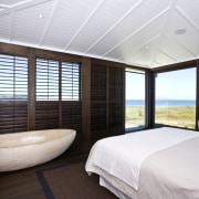 View of master bedroom which has a stone bedroom, ceiling, interior design, real estate, room, window, window covering, window treatment, wood, white, black
