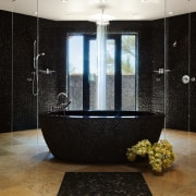 View of freestanding bathtub, featuring limestone tiled flooring bathroom, floor, flooring, glass, interior design, plumbing fixture, room, tile, black