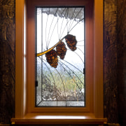 Image of unique designs on glass doors created glass, picture frame, wall, window, wood, red