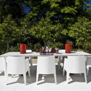 View of patio with water and sun resistant chair, furniture, outdoor furniture, patio, table, white, brown
