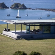 Image of the exterior of this beautifully designed house, real estate, roof, water, brown, teal