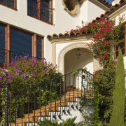 image of the exterior of this newly renovated architecture, balcony, building, cottage, courtyard, estate, facade, flower, hacienda, home, house, mansion, neighbourhood, outdoor structure, plant, property, real estate, residential area, villa, window, brown