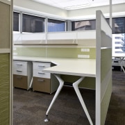 Interior view of an office which includes office desk, floor, furniture, office, product design, table, white