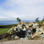 Images of the exterior of this home with landscape, plant, real estate, sky, tree, water, white