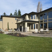 Images of the exterior of this home with cottage, elevation, estate, facade, farmhouse, home, house, mansion, property, real estate, residential area, siding, villa, window, yard, brown