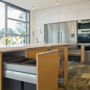 View of kitchen which features cabinetry designed and countertop, floor, interior design, kitchen, gray, brown