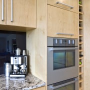 View of a kitchen designed and manufactured by cabinetry, countertop, home, home appliance, interior design, kitchen, orange