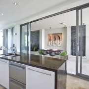 Image of kitchen and dining area which have cabinetry, countertop, cuisine classique, interior design, kitchen, real estate, gray