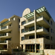 Exterior view of the Lindfield Apartments which feature apartment, architecture, building, condominium, elevation, facade, home, house, mixed use, neighbourhood, property, real estate, residential area, brown