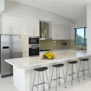 View of kitchen which features a Miele oven, cabinetry, countertop, cuisine classique, interior design, kitchen, real estate, room, gray