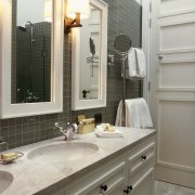 View of bathroom featuring vanity with twin basins, bathroom, bathroom accessory, bathroom cabinet, cabinetry, countertop, cuisine classique, floor, home, interior design, kitchen, room, sink, gray