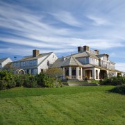 Exterior view of a large cottage with cedar cloud, cottage, estate, facade, farmhouse, grass, home, house, land lot, landscape, lawn, mansion, property, real estate, residential area, roof, sky, suburb, villa, teal