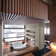 Bathroom, featuring bathtub with timber surround, tiled flooring, architecture, ceiling, daylighting, house, interior design, window covering, wood, brown, red