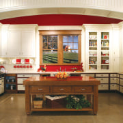 View of a country kitchen which features cabinetry cabinetry, countertop, cuisine classique, furniture, interior design, kitchen, room, brown, white