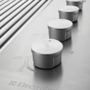 View of knobs on outdoor cooking equipment from black and white, product, product design, table, white