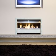 View of a lounge area which features the fireplace, hearth, heat, white, black