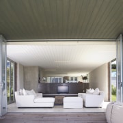 view of the living area with couches, telvision, architecture, ceiling, daylighting, home, house, interior design, living room, real estate, window, gray, white