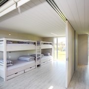 View of the bunkroom with 2 sets of architecture, ceiling, daylighting, floor, house, loft, real estate, gray