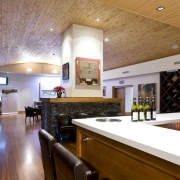 View of a bar and eating area which ceiling, countertop, interior design, kitchen, real estate, room, wood