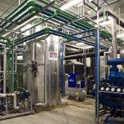 Interior view of the wine making area which engineering, factory, industry, machine, manufacturing, mass production, product, pumping station, gray