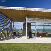 Exterior view of house with cladding, roofing, landscaping, architecture, house, outdoor structure, real estate, shade, brown