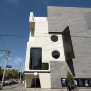 Exterior view of the MRC which features wrought architecture, building, facade, house, residential area, sky, wall, blue, gray