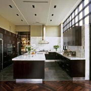 View of a new kitchen which features limestone cabinetry, ceiling, countertop, cuisine classique, flooring, interior design, kitchen, room, wood flooring, black