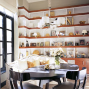 View of the breakfast area which features a dining room, furniture, interior design, room, table, gray