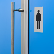 View of bathrooms inside the eco-friendly office building. door handle, product, product design, teal