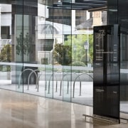 Interior view of the eco-friendly offices which were door, glass, gray, black