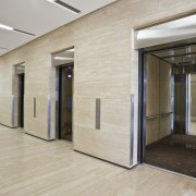 Interior view of the eco-friendly offices which were architecture, ceiling, door, floor, flooring, interior design, lobby, real estate, wall, gray