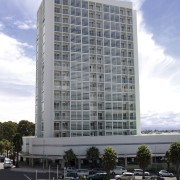 Exterior view of the entrance way of the apartment, architecture, building, city, commercial building, condominium, corporate headquarters, daytime, downtown, facade, headquarters, hotel, metropolis, metropolitan area, mixed use, neighbourhood, real estate, residential area, sky, skyscraper, tower block, urban area, gray, white