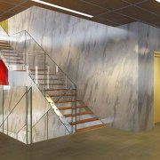 View of a stairway with glass balustrade inside architecture, ceiling, floor, interior design, lobby, wall, gray, brown